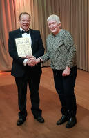 Alan Mayle receiving his 50 year membership certificate.
