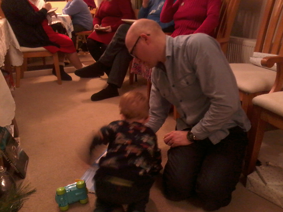  Alfie enjoying his presents with his Uncle Chris.