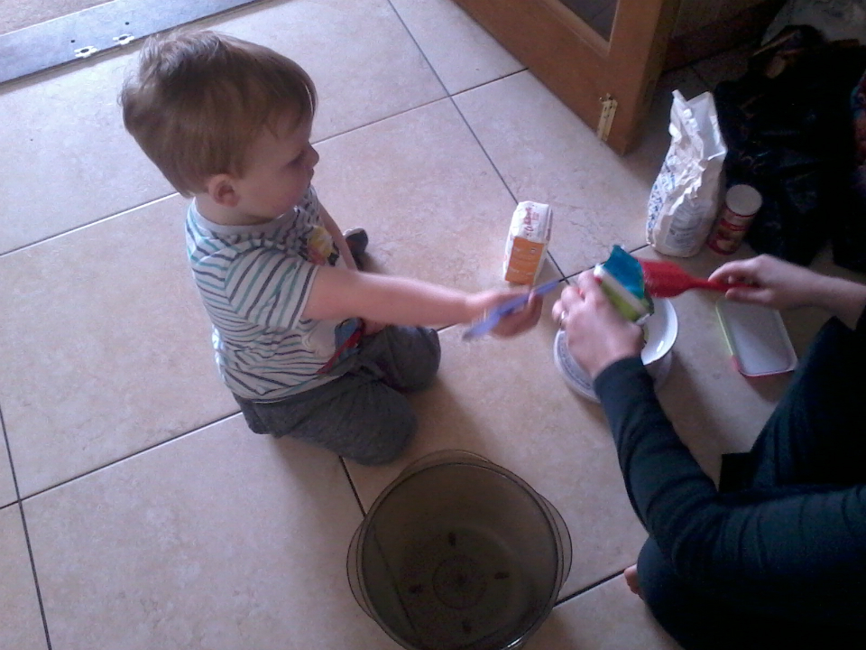 Alfie helping his Mummy make cake for this afternoon's tea.