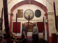 Adrian Craddock & David Twissell trying to put the peal-board clock right at Grundisburgh.
