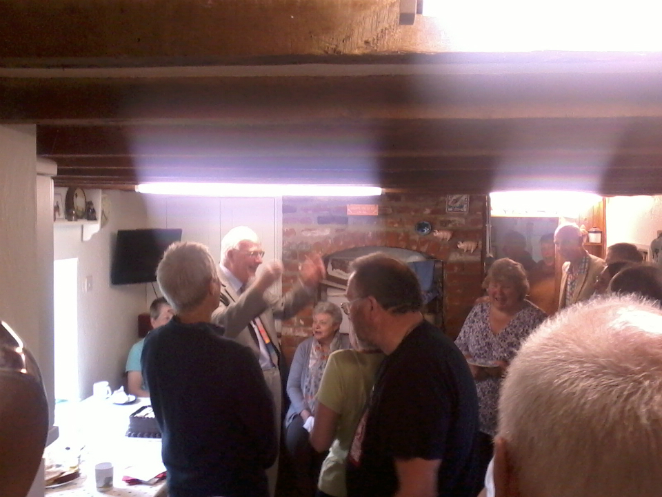 Mike Whitaker leads the singing at his party!
