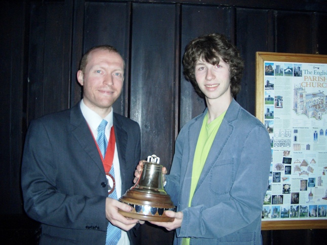 Picture of The Lester Brett Trophy being presented to Debenham by the Guild Ringing Master, Richard J Munnings