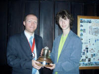 Picture of The Lester Brett Trophy being presented to Michael Carruthers of Debenham by the Guild Ringing Master, Richard J Munnings