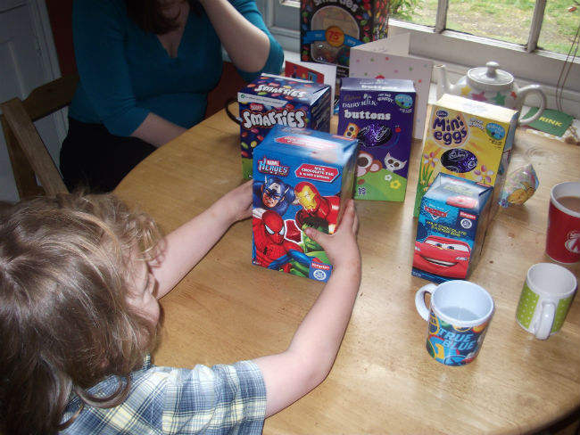 Mason selecting Easter eggs.