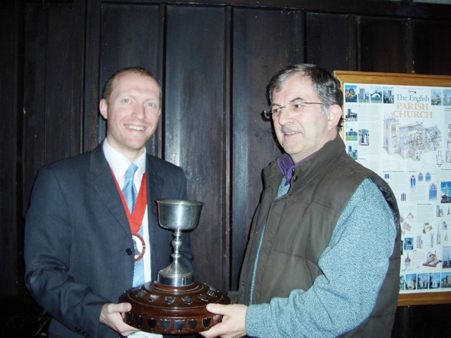 Picture of The Rose Trophy being presented to Owen Claxton by the Guild Ringing Master, Richard J Munnings