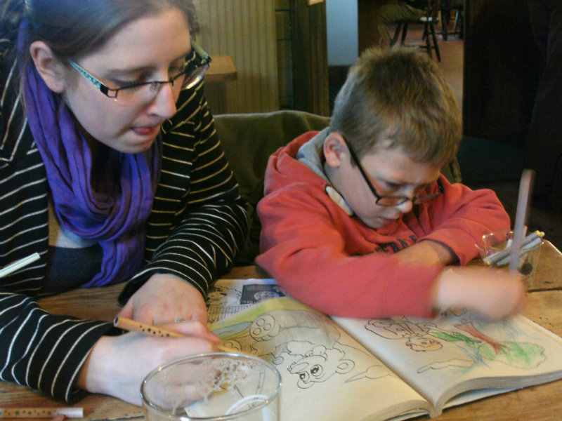 Ruthie and Mason having a drawing competition in The Ship, Blaxhall.