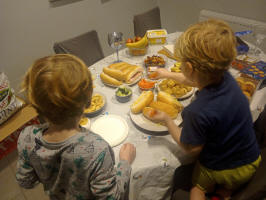The boys tuck into food at our New Year's Eve ‘party’!