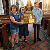 Guild Ringing Master Katharine Salter receiving the Ridgman Trophy from judges Sally Brown & Lewis Benfield (taken by Mike Cowling)