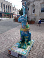 One of the hares, with the spire of Ipswich Minster in the background.