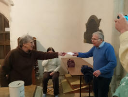 Mary presents Peter with his birthday card at Pettistree practice.