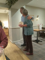Mike Whitby presenting Mary Garner with 'Mary's Monthly Plate' at the Pettistree Dinner.