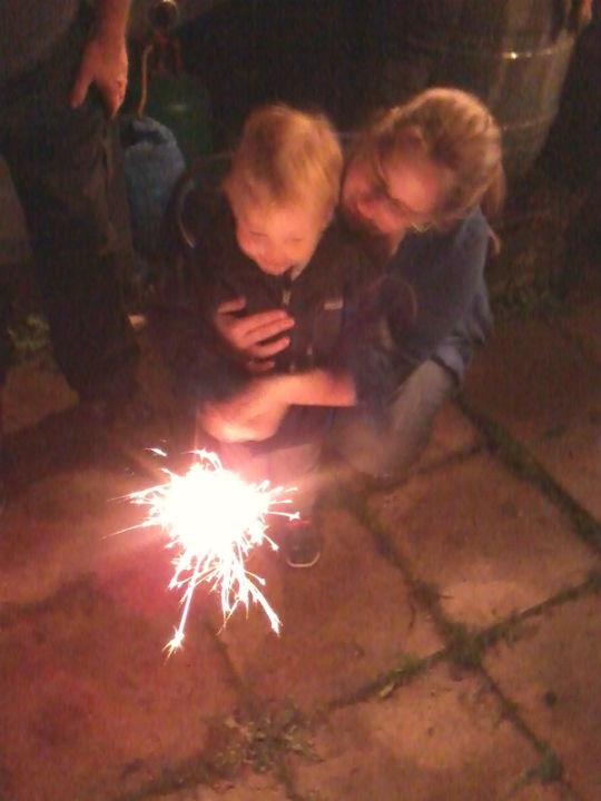 Alfie enjoying sparklers for the first time at his Granny's house, under close supervision from Mummy!