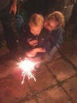 Alfie enjoying sparklers for the first time at his Granny's house, under close supervision from Mummy!