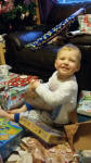 Alfie gets stuck into his presents.