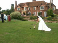 Mrs Munnings playing croquet on Boxted Hall's lawn.
