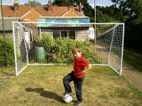 Mason in front of his newly constructed goalposts.