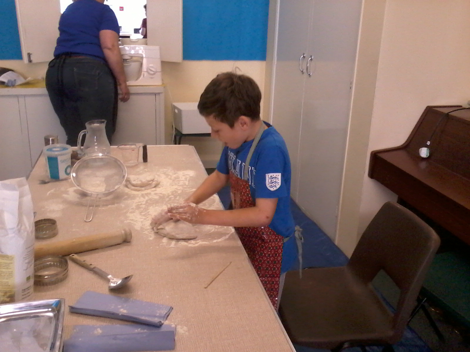 Mason making bread at St Mary's Church Centre.
