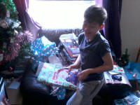 Mason tucks into his waiting presents.