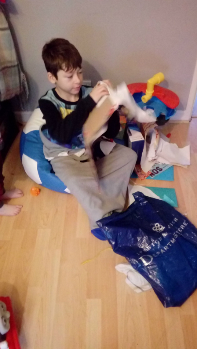 Mason opening his presents.