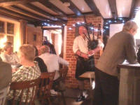 Ron plays the bagpipes at the Pettistree Ringers' Dinner.