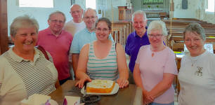 Ruthie with her cake and some of the others at Pettistree practice.