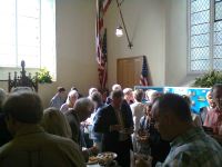 The crowds mingle after the service of thanksgiving at Clopton.