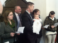 Katelynn with her parents and some of her Godparents.