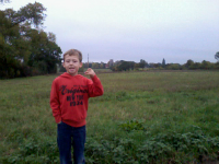 Mason on our walk, with Monewden church in the background as the quarter is being rung.