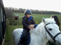 Mason riding a pony.