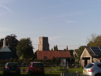 Pettistree Church In Early Summer Evening Sunshine From Across The Village.