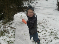Mason with his snowman.